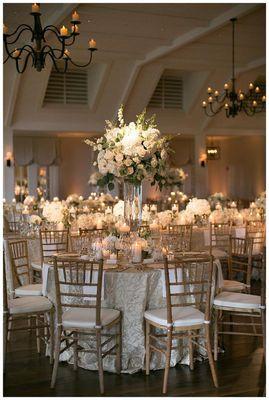 Floral Centerpiece with Classic Ivory and Gold Chiavari Chairs