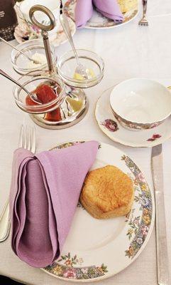 Place setting with scone and toppings