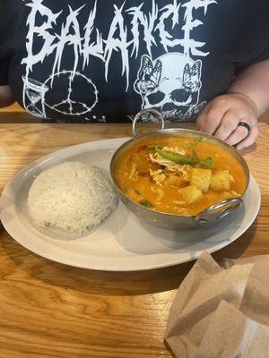 Red curry with chicken and white jasmine rice