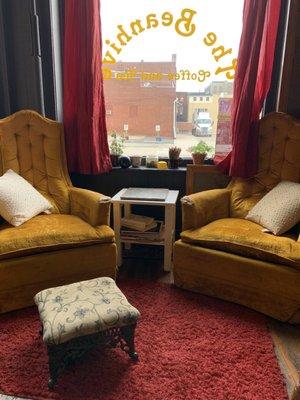 Eclectic, thrift store vibe with well worn seating