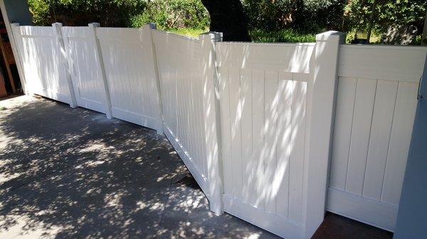 new vinyl fence; replaced rotting wooden fence