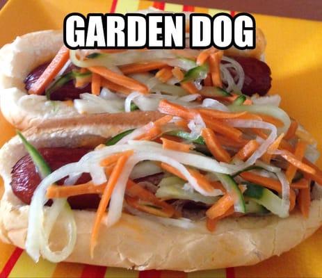 An all beef deep fried hot dog with spicy mayo and topped with a cool sweet slaw