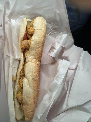 Small shrimp po-boy. So they say it's small but it was more than enough for one person. Hated to see the large one. Lol.