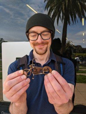 My very happy bf holding the tiny motorcycle Bob gifted me.