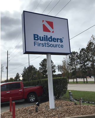 Builders FirstSource Building Materials Millwork Facility Street Sign located at 15585 I-45 South Conroe, TX.