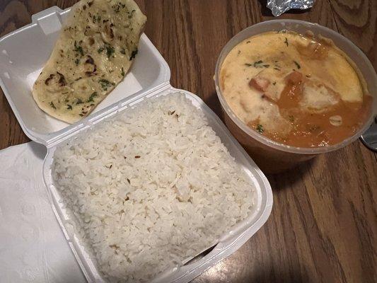 Chicken tikka masala with garlic naan and rice