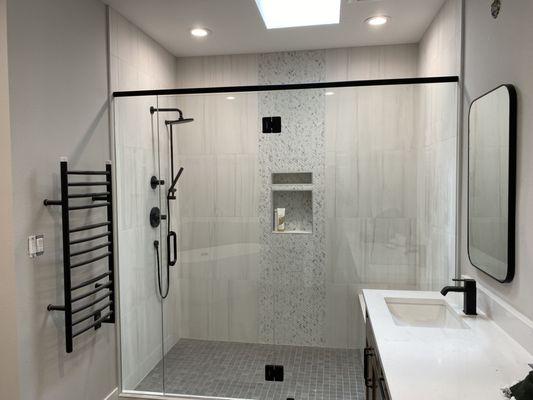 Recessed lighting in the high ceiling shower