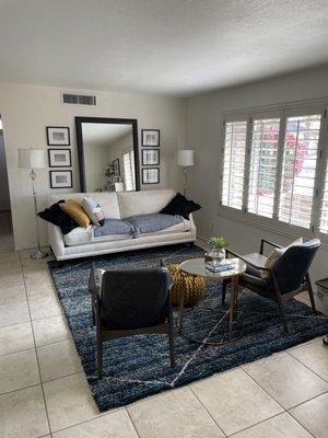 This room, from the couch to the pillows to the mirror to the table to the pouf are all from furniture affair!