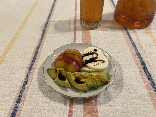 Delicious fresh Palisade peaches, avocado and fresh mozzarella with a glorious drizzle of aged balsamic reduction, yummy.