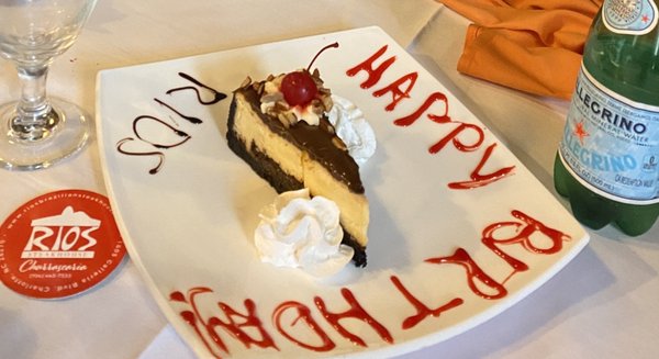 Slice of cheesecake given for birthday at no cost