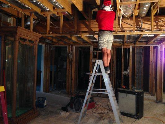 Cleaning affected framing on a water/mold loss. Fripp Island, South Carolina.