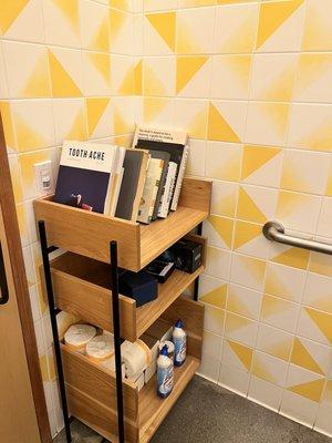 Cute bathroom with a bookshelf haha.