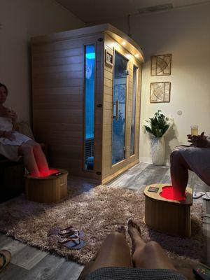 Sauna room with massage loungers and infrared foot therapy