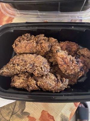 Overcooked, burnt and inedible chicken strips.