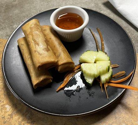 Crispy Thai Spring Rolls with dipping sauce.