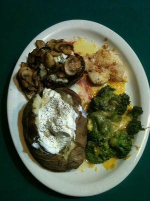 Filet Mignon with blue cheese and sautéed mushrooms, with sea scalloped scampi, baked potato, and broccoli loaded with cheddar.