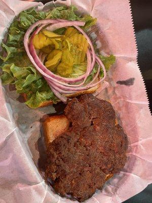 Burger. Good taste and cooked well. Weird shape and also on Texas toast.