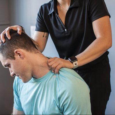 Soft tissue manipulative therapy of the cervical spine musculature.