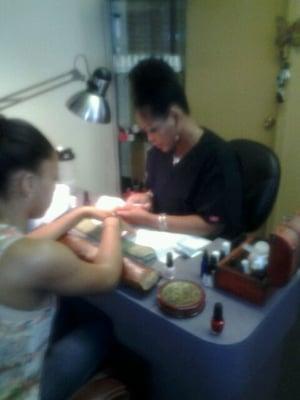 Alicia doing manicure