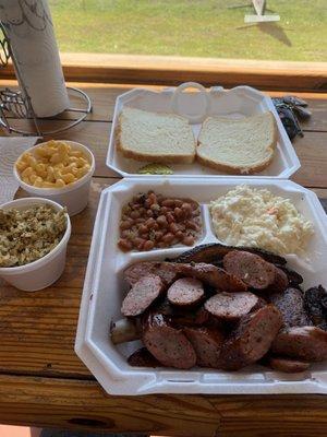 Ribs plus 2 meats (sausage and brisket) with coleslaw, beans, Mac and cheese, and dirty rice. Definitely took a lot home.