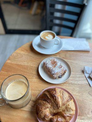 Chocolate and butter croissant and cappuccino