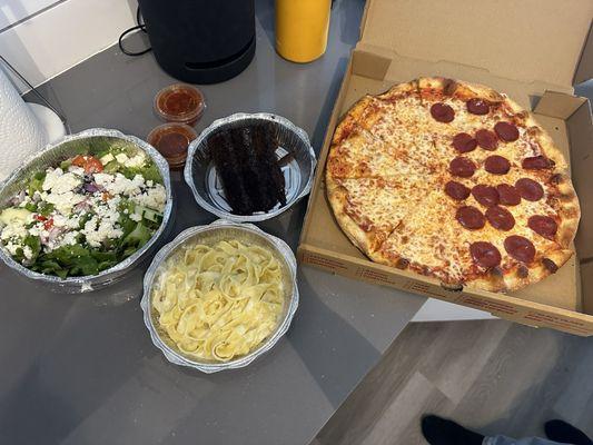 Fettuccini Alfredo, Classic Cheese Pizza, Greek Salad, and Triple Layer Chocolate Cake