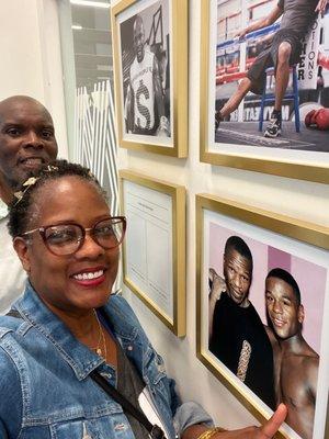 My husband and me standing in front of Mayweather and his dad