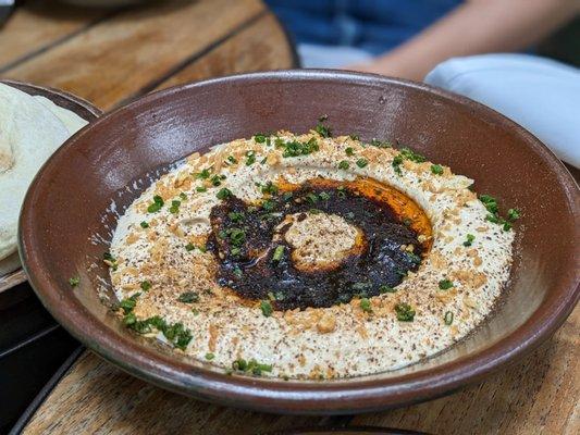 Hawaj Chile Hummus $18 (black garlic, chive)