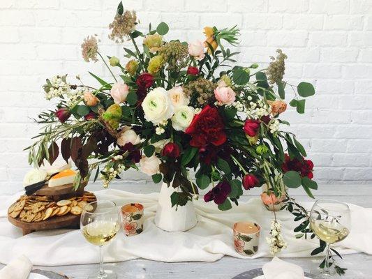 still life style centerpiece with peonies, ranunculus, chocolate lace, eucalyptus, garden roses