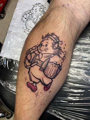 Tattoo of my spirit animal - A hedgehog in lederhosen drinking beer, eating sausages. Design and ink executed by Jenna Haas.