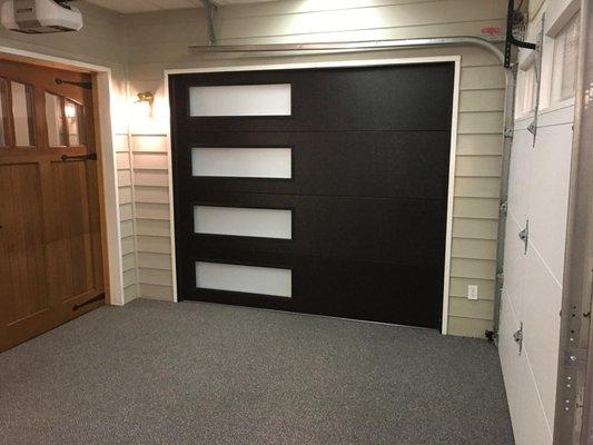 Just installed a contemporary Black Flush Panel garage door with side windows in our Modesto showroom!