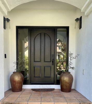 Front door with side lights.