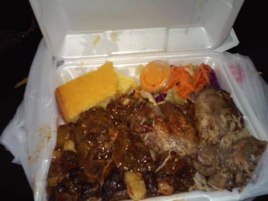 Ox tails, jerk chicken, cornbread, cabbage,  rice and peas