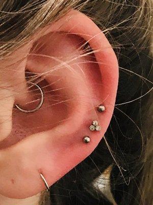 Triple middle Cartlidge piercings and a Daith to take away migraines. Love it!!