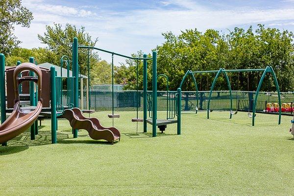 Turf covered playground at SStepping Stone School at Round Rock-Gattis School Road