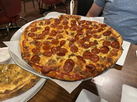 Pepperoni, sausage, ricotta, mozzarella pizza