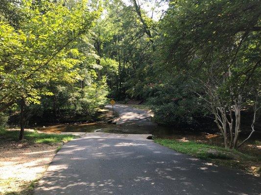 At the end of August, the washed out road was only ankle deep and easily crossed by car to get into the parking lot