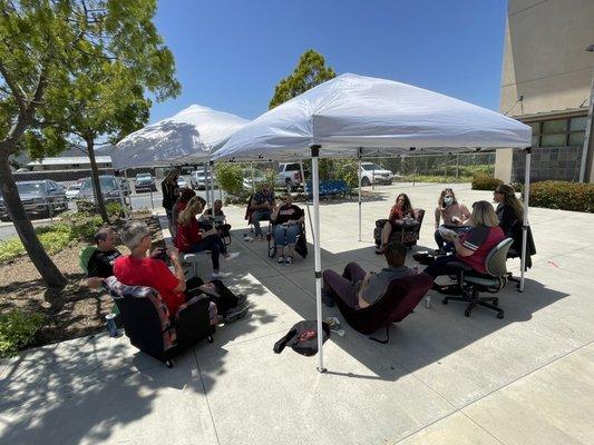 The staff socially-distanced eating and enjoying the appreciation