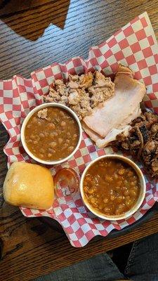 Chopped brisket, smoked turkey, pulled pork, baked beans, yeast roll