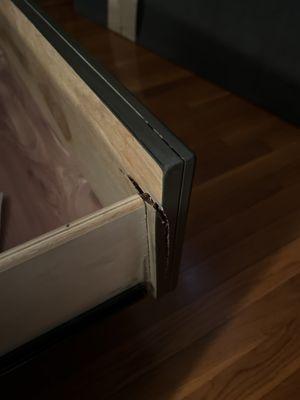 Damage on every side of each drawer.