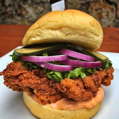 Spicy southern fried chicken sandwich with chipotle aoli and house made hot pickle