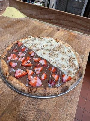 Dessert pizza Nutella with strawberries and banana cinnamon.