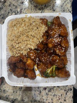 Sesame chicken ( with extra chicken) broccoli, an egg roll and soup on the side.