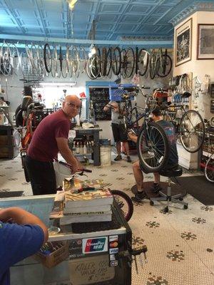 Staff fixing bikes and adding the accessories to my daughter's new-to-her bike