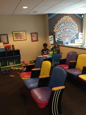 Movie theater seating in the waiting room