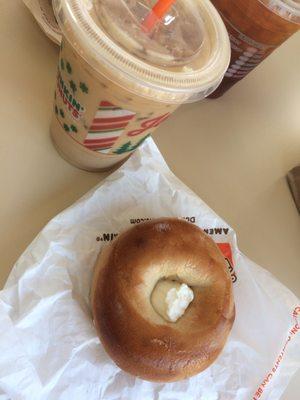 Plain bagel and cream cheese with iced hazelnut macchiato.