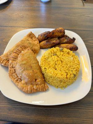 Beef empanadas, arroz con gandules, fried plantains.