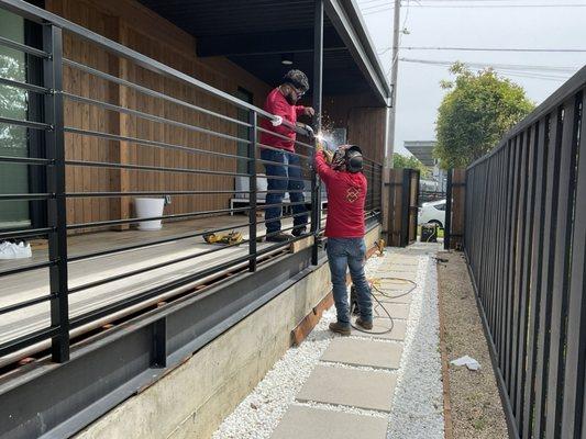 OP Metal Works Inc. Crew working on the installation of this beautiful horizontal railing