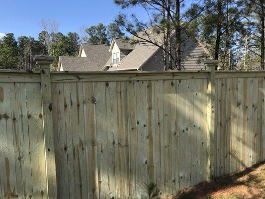 Capped wood privacy