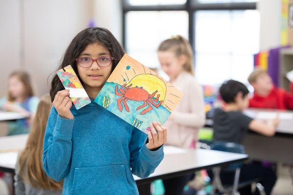 A student shares her artwork and the bookmark we created with it.